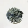 Polished natural labradorite crystal tumbled stones presented in a small white ceramic bowl - Labradorite / 100g Pack