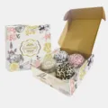 Set of 4 scented soy wax candles in animal print tins within a decorative floral gift box - 4-Pack Gift Box Set Type B