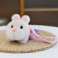 Cute pink plush bunny keychain charm for backpacks with soft fur and pink hanging loop - Prone Pink Rabbit