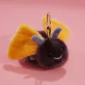 Cute plush bumblebee insect keychain with yellow fuzzy wings and a smiling face - Moth / 13cm