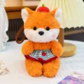 Adorable orange plush fox keychain accessory wearing a blue striped apple skirt - Fox in Dress / 16cm