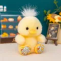 Adorabile anatroccolo di peluche giallo con ciuffo bianco e zampe fiorite - 10cm / Anatra Floreale