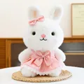 Adorable white rabbit plush toy wearing a pink princess dress decorated with bows - Pink Rabbit