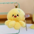 Cute yellow plush octopus keychain pendant with soft fur texture and blue embroidery detail - 10cm / Yellow