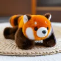 Peluche de panda rojo tumbado adorable con suave pelaje de color naranja - Panda Rojo / 20cm