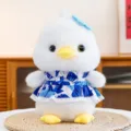 Cute white duck plush toy wearing a lovely blue floral dress with a bow tie detail - 22cm / White