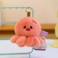Cute coral pink octopus plush keychain with angry expression and premium gold ring - 10cm / Orange