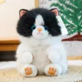 Adorabile gatto di peluche nero e bianco simulazione bambola con occhi blu e etichetta carina. - 15cm / Mucca