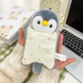 Cute grey penguin plush keychain holding a small polka dot pillow, perfect for backpack charm - Penguin