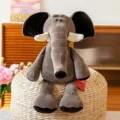 Adorabile elefante di peluche grigio con grandi orecchie su pouf intrecciato - 25cm / Elefante