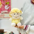 Cute plush sheep doll wearing a yellow nightcap and bib, soft cuddle toy for kids birthday gift - 25cm / Yellow