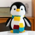 Soft and cuddly penguin plush toy with a vibrant colorful knitted scarf accessory - Penguin / Penguin Yellow Scarf