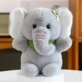 Cute grey plush elephant toy with green scarf and yellow bow, soft stuffed animal for kids. - Elephant / Grey Elephant