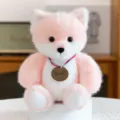 Cute pink and white plush fox toy with a decorative wooden tag hanging around its neck - Pink Fox