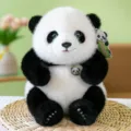 Realistic high-quality panda plush toy with soft fur sitting on a natural woven mat - Black / 25cm