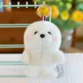 Adorable white plush seal animal keychain with a golden ring and striped ribbon detail - 13cm / Sea Lion Shape