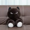 Cool grumpy black cat plush toy with white paws sitting on a brown leather sofa texture - Black / 20cm