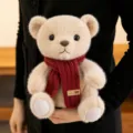 Adorable beige teddy bear plush toy wearing a cozy red knitted scarf, SKU variant display - Scarf Style / Camel