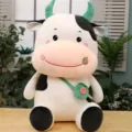 Adorable white and black cartoon cow plush toy featuring a green watermelon bag detail - Green Watermelon / 33cm