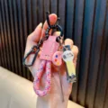 Multifunctional pink woven rope keychain set with nail clipper and ear spoon charms - Pink
