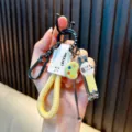Multi-functional creative keychain with yellow woven rope, nail clipper and ear pick charm - Beige