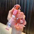 Cute pink octopus liquid quicksand keychain with sailboat and Just Keep Doing It strap - Pink