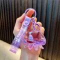 Cute purple acrylic octopus liquid keychain with mini sailboat and glitter sand flow - Purple