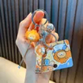 Cute orange lion cartoon keychain set including a metal nail clipper and ear pick tool - Taiyaki