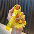Cute yellow jellyfish liquid oil shaker keychain with miniature sailboat and strap - Yellow