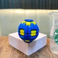 3D fidget gear ball toy in blue and yellow color on white display block - No Keychain / Blue