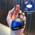 Llavero de casco de moto negro luminoso con visera azul y una luz LED brillante - Luminoso / Negro