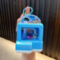 Blue mini claw machine toy keychain with light-up feature and colorful balls inside - Astronaut Style (趣味带灯夹球机-) / Blue