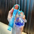 Blue fish-shaped quicksand oil keychain featuring a cute white polar bear figure - Royal Blue Polar Bear / Sapphire Blue