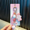 Porte-clés mignon rose et blanc sur le thème du chocolat avec pompon et étoile - Rose