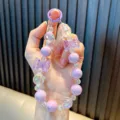 Purple beaded crystal bow phone charm keychain with iridescent beads and round ring clasp - Purple