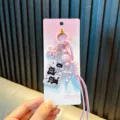 Cute pink braided rope keychain featuring cartoon black cat charm and flower pendant - Pink
