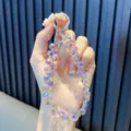 Schillerndes Kristall-Handyband mit funkelnden facettierten Wassertropfen-Perlen - Funkelnder Kristall Träne / Hellviolett