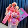 Pink dopamine astronaut bear keychain with a 'DREAM' silicone strap for bag charms. - Star & Bear / Pink