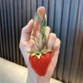 Realistic 3D red strawberry bag charm made of durable resin with a cute green strap - Medium Red Strawberry (Leather Cord) / Red