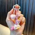 Lindo llavero de unicornio con pompón rosa y colgante de estrella para bolsos de moda - Rosa