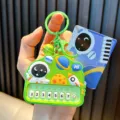 Green astronaut toy piano keychain with mini numbered keys and hanging bell accessory - Astronaut Piano / Green
