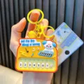 Mini yellow toy piano keychain with a cute dog character and 8 functional keys for kids - White Dog Piano / Yellow