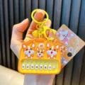 Corgi puppy themed mini musical piano keychain with yellow bell and 8 white keys - Shiba Inu Piano / Yellow