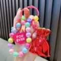 Kleurrijke kralen sleutelhanger met rode gelukzak en roze hartje - Kleurrijke kralen gelukstas / Rood