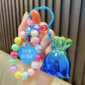 Handgemaakte kleurrijke kralen sleutelhanger met hartje en gelukzakje bedeltje - Kleurrijke kralen gelukstas / Blauw