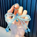 Funkelnder blauer Kristallperlen-Schleifenanhänger mit Wassertropfen für Taschen und Handys. - Funkelnder Schleifen-Anhänger (Mit Dichtung) / Blau