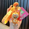 Cute yellow astronaut star bear keychain with Dream strap and stylish silver boots - Star & Bear / Yellow