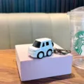 Detailed white mini alloy car model keychain toy, perfect accessory for bags or keys - White