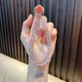 Funkelndes lila Kristallperlen-Handyband mit Strass-Fischschwanz-Anhänger für Damen - Lila