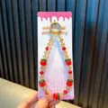 Colgante para móvil de cuentas rojas con detalles dorados y tarjeta rosa - Rojo